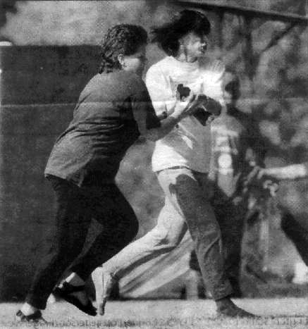 UPC president Karen Davis rescues wounded pigeon at Labor Day Pigeon 
            Shoot in Hegins, PA