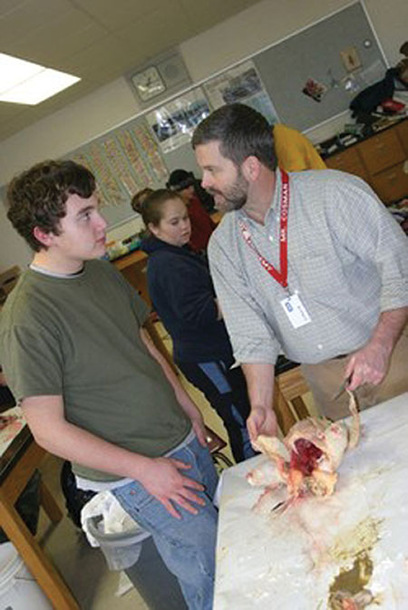 High school teacher, Eric Cosman (right)