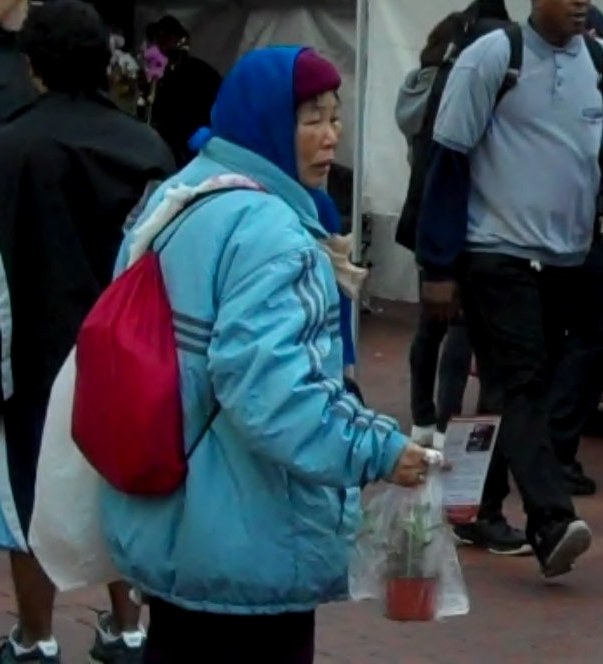 Sad Chinese Woman Watching Video