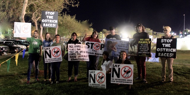 Protesters holding signs Friday night