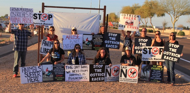 Protesters holding signs on Sunday evening