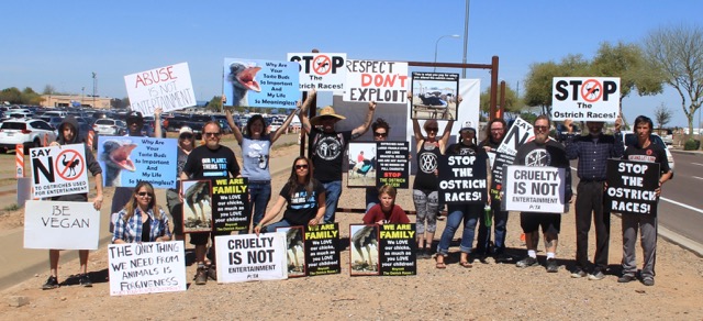 Protesters holding signs on Sunday morning