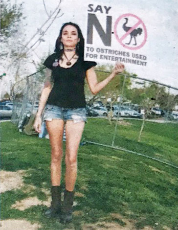 Ostrich race protester holding a sign