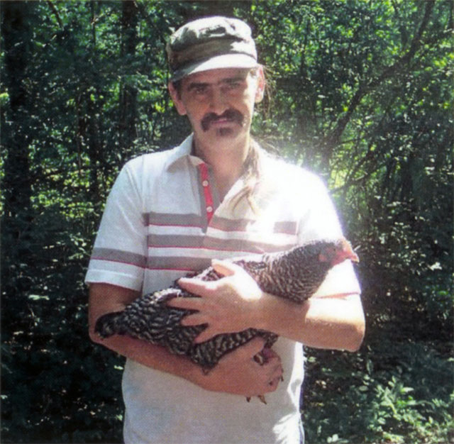 virgil butler holding chicken