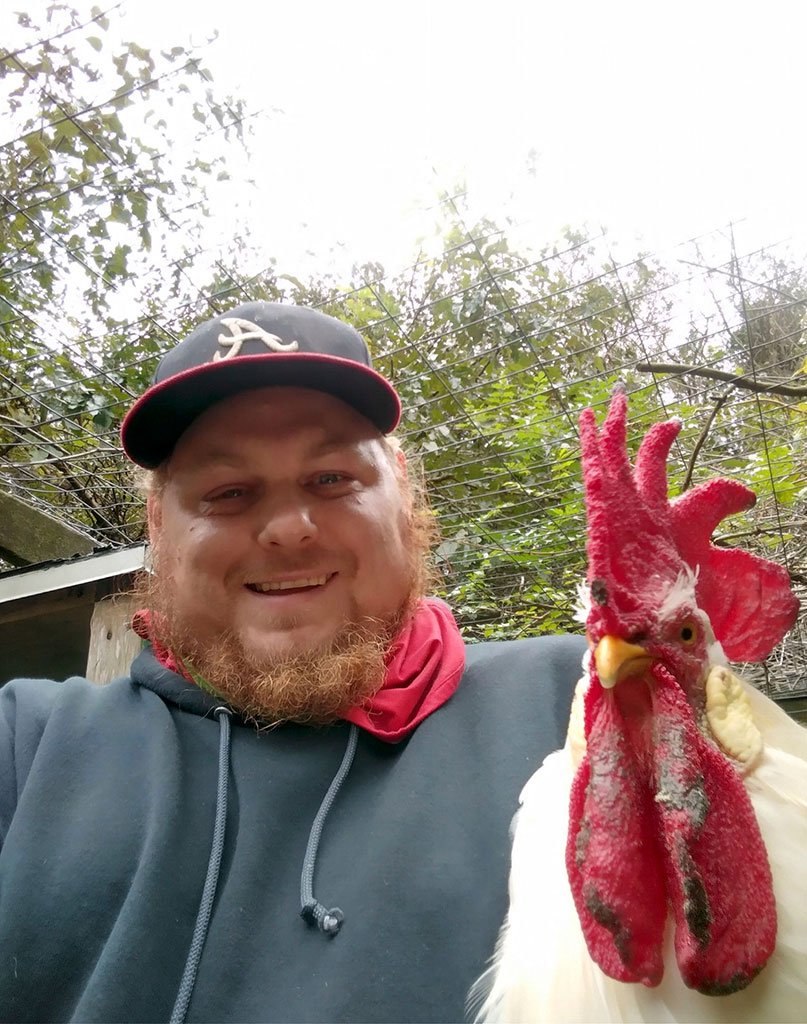 Paul Connon with Rupert his rooster-in-arms