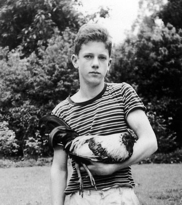 UPC member and chicken sponsor, David Jones, holds a rooster in his youth